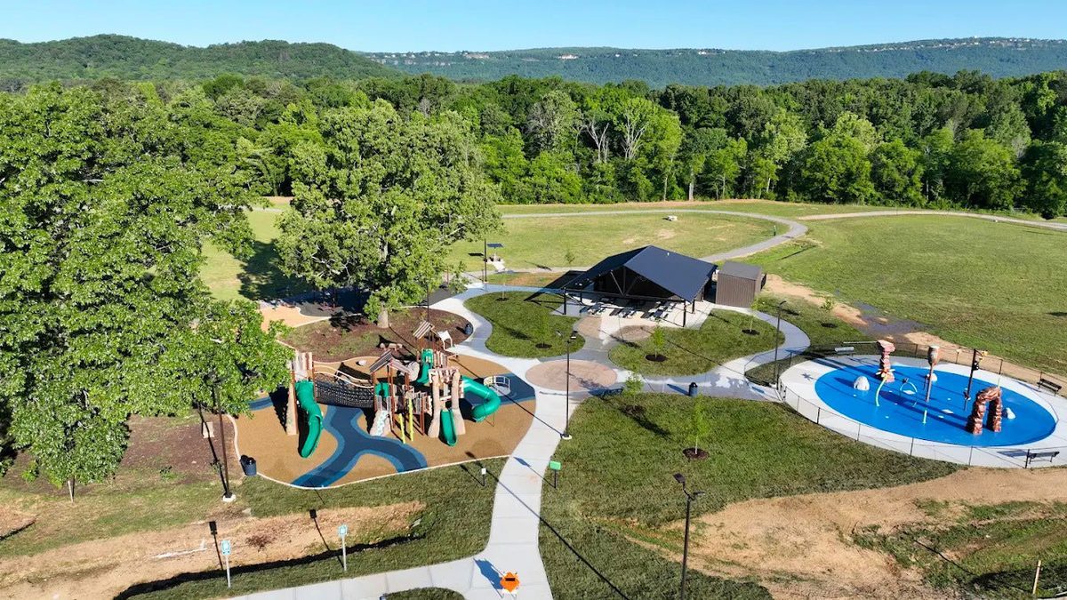 Aerial view of Adventure Acres, showing the playground, pavilion and splash pad linked by concrete walkways